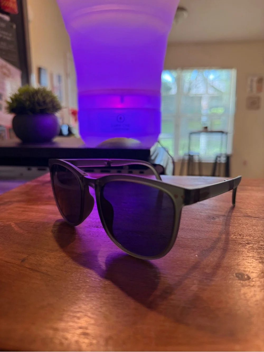 Green sunglasses with black lenses